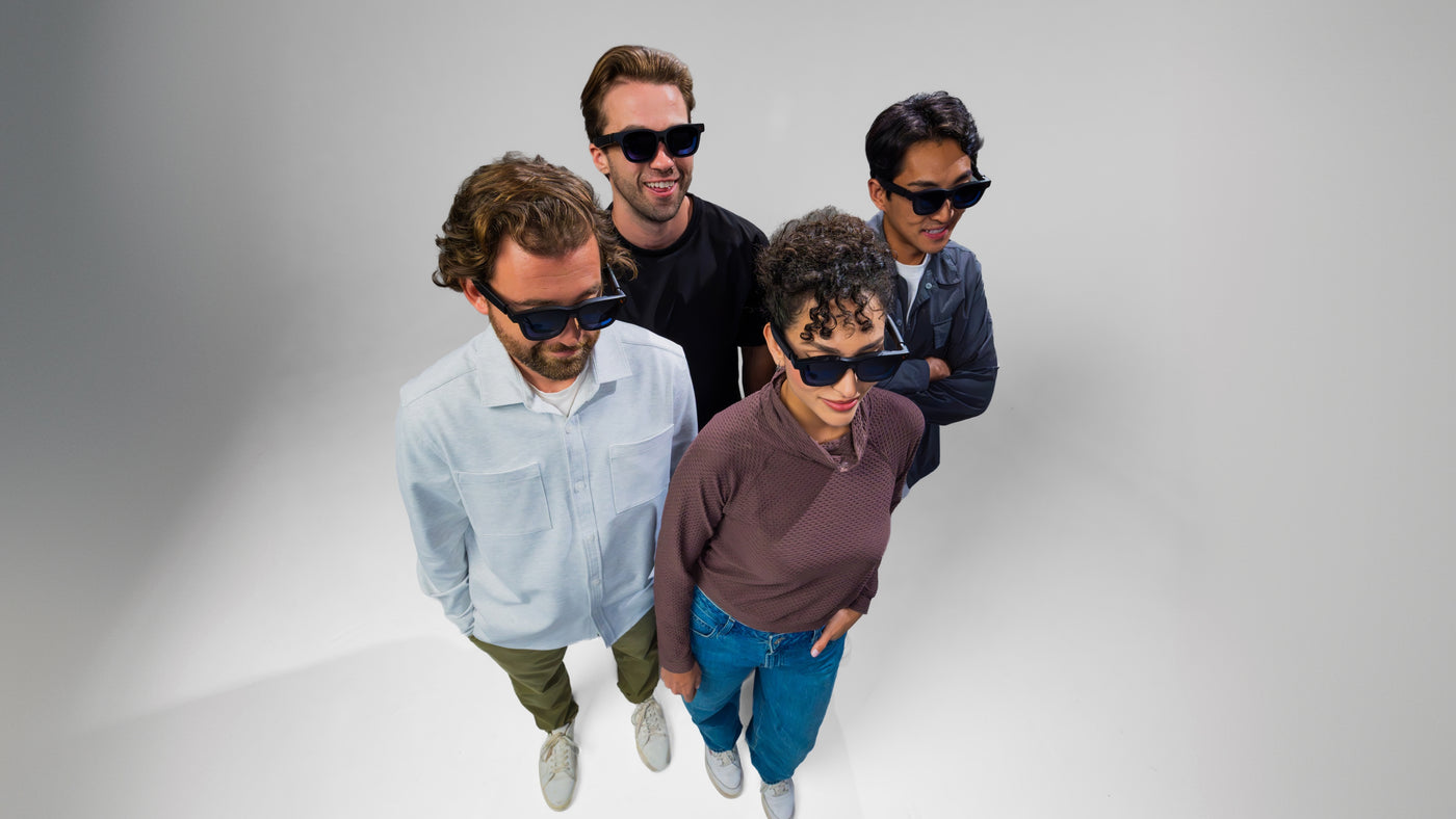 Four adults wearing VITURE Pro 2 glasses